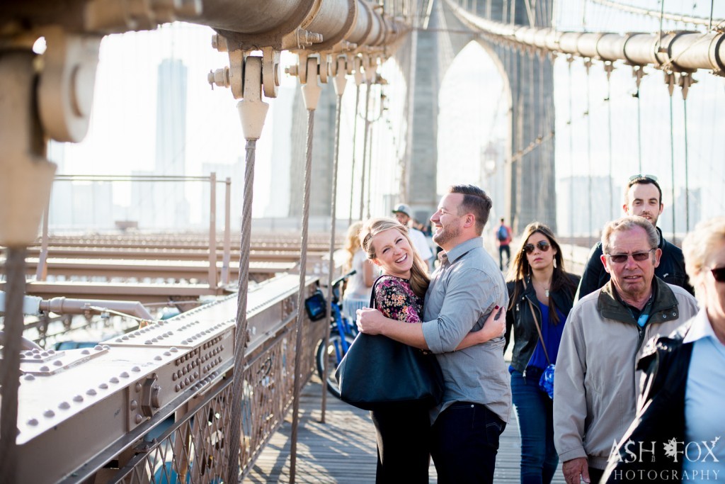 newlyweds hugging on Brooklyn Bridge