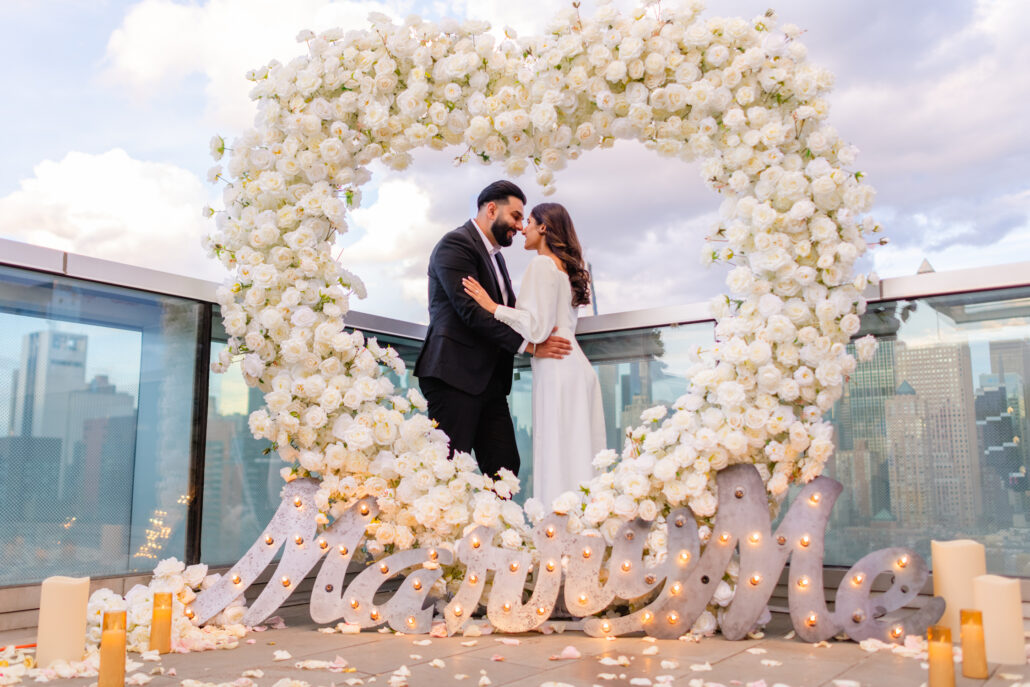 Stunning white roses standing arch in NYC for a surprise marriage proposal