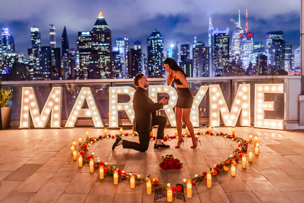 Marry Me sign marriage proposal on a rooftop in NYC