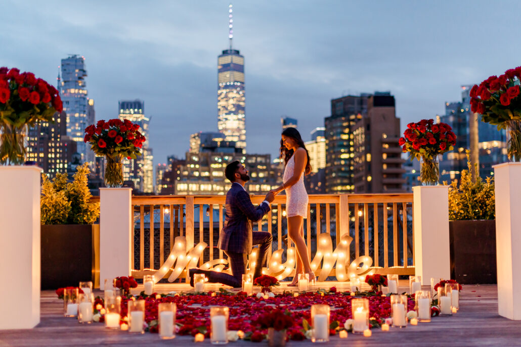 Luxury New York City rooftop marriage proposal with marry me sign and hundreds of red roses by Ash Fox Proposals